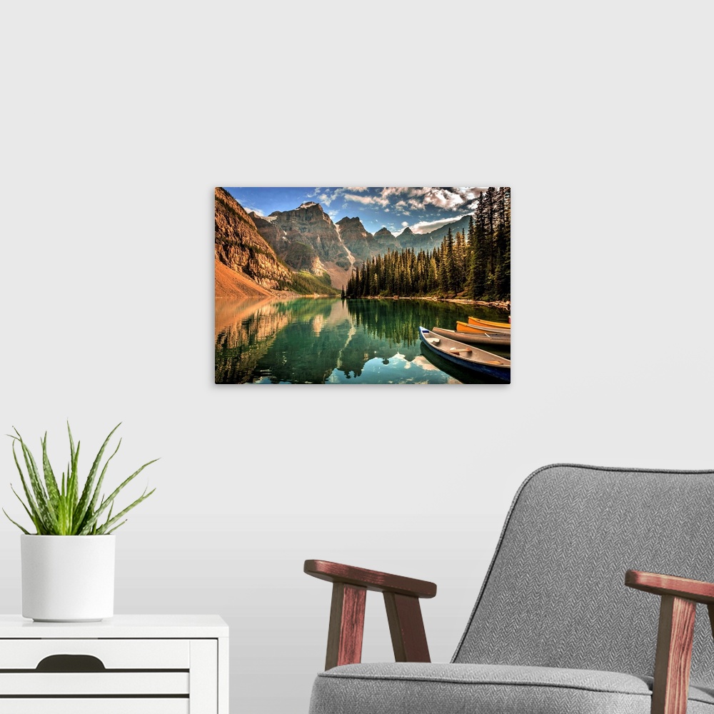 A modern room featuring Photograph of a still lake with canoes in the Canadian Rockies, Banff National Park.