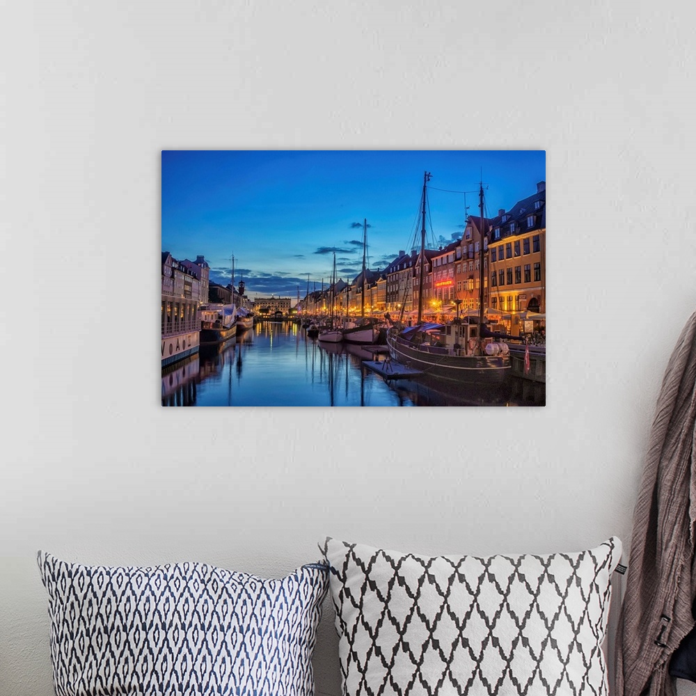 A bohemian room featuring Waterfront with boats in the evening, Copenhagen, Denmark.