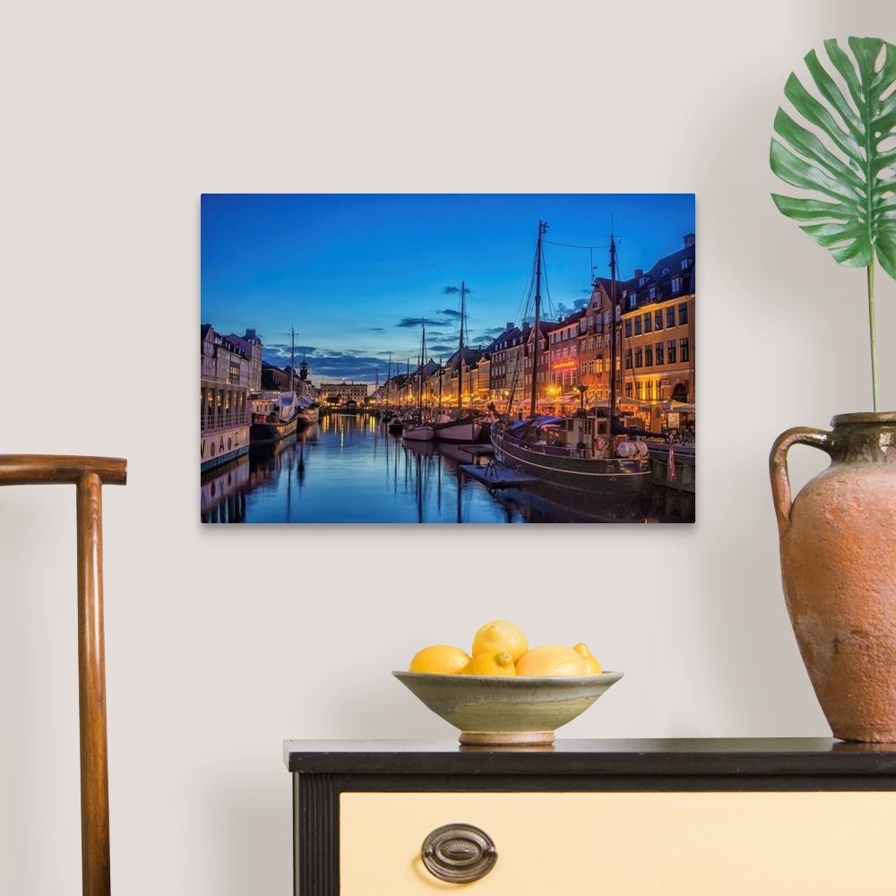 A traditional room featuring Waterfront with boats in the evening, Copenhagen, Denmark.