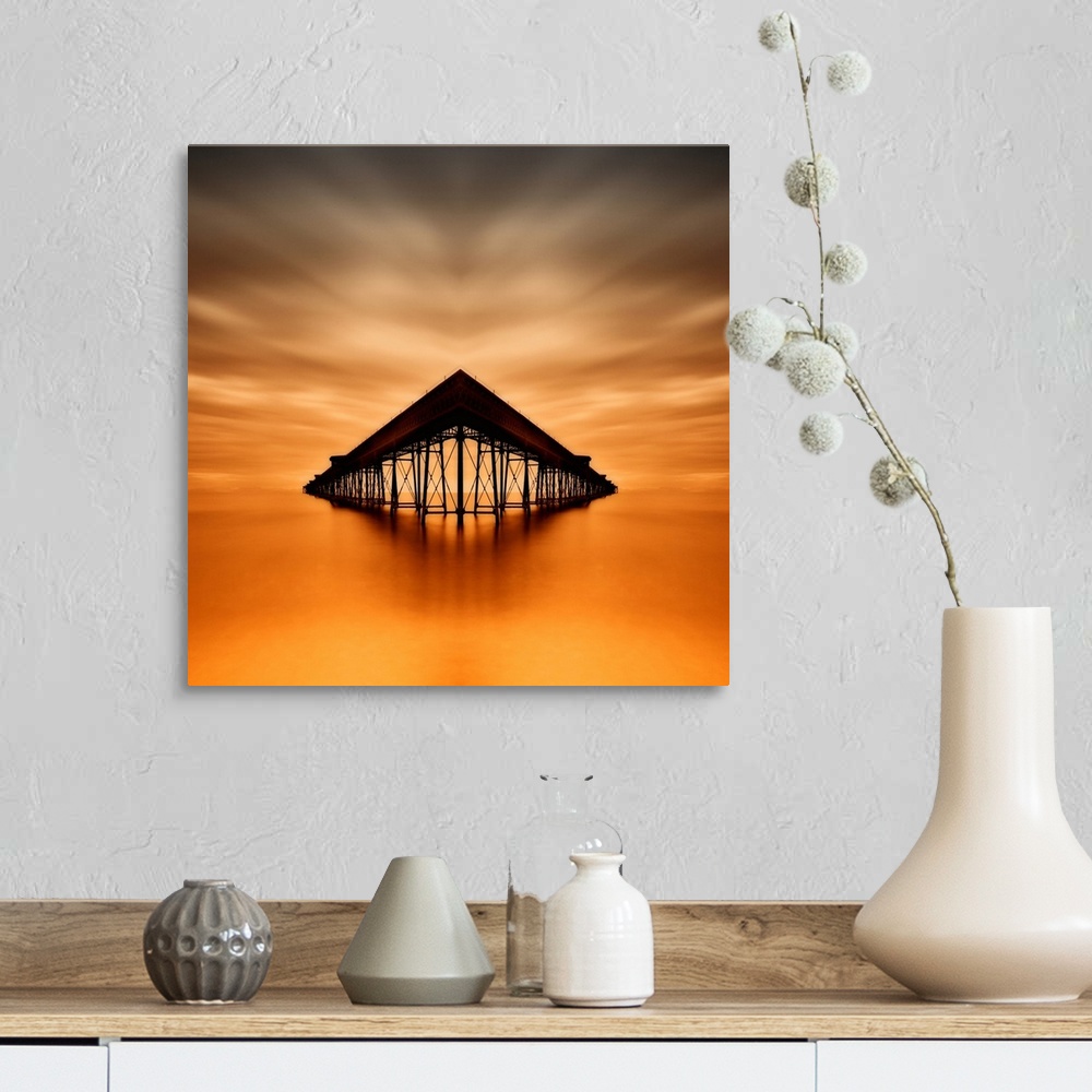 A farmhouse room featuring Symmetrical image of Queen's Pier in the ocean at sunset, Isla of Man.