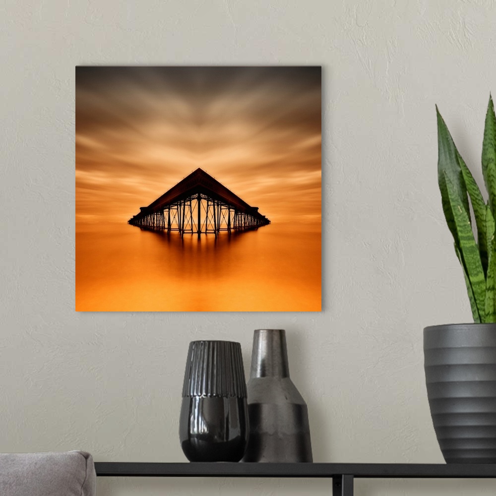 A modern room featuring Symmetrical image of Queen's Pier in the ocean at sunset, Isla of Man.