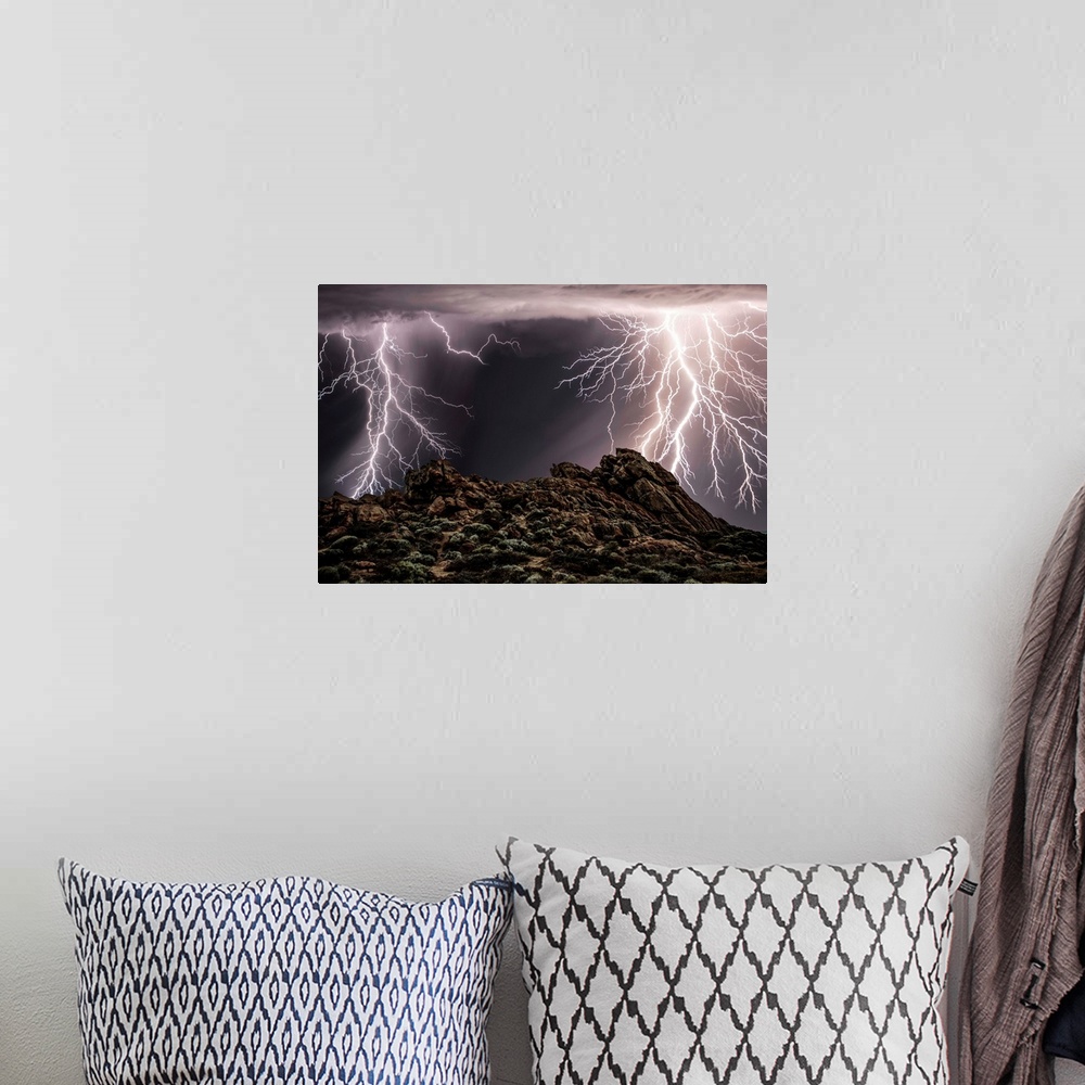 A bohemian room featuring Several lightning strikes during a thunderstorm over Western Australia.