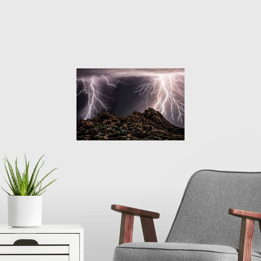A modern room featuring Several lightning strikes during a thunderstorm over Western Australia.