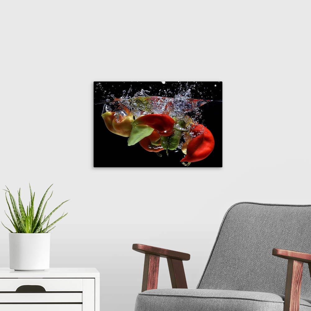 A modern room featuring Peppers falling into water, over black background.
