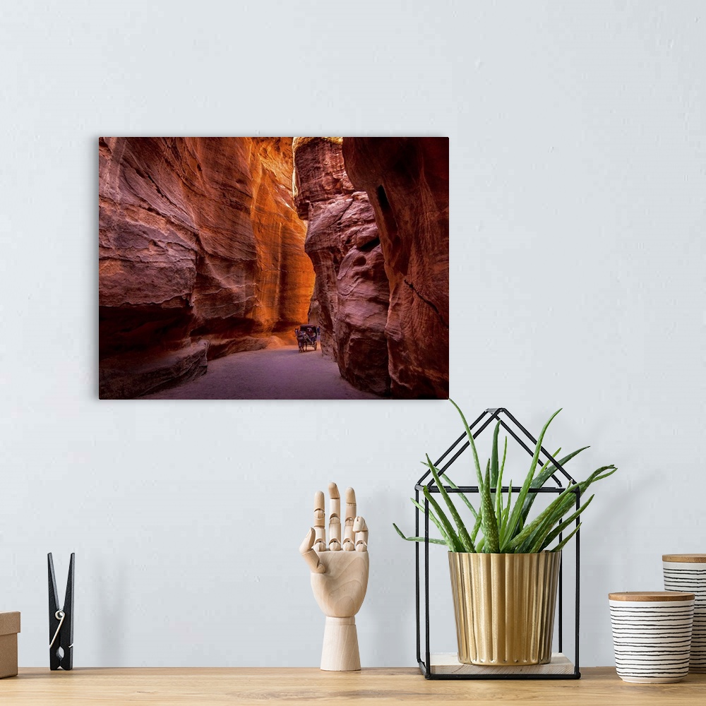 A bohemian room featuring Red rock canyon walls in Petra, Jordan.