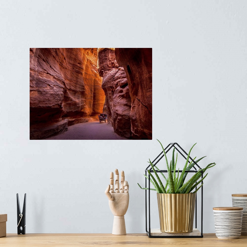 A bohemian room featuring Red rock canyon walls in Petra, Jordan.