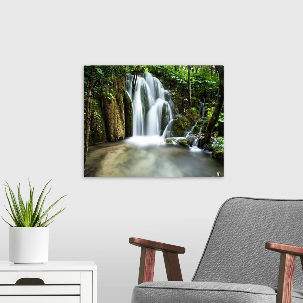 A modern room featuring Lovely little waterfall in Plitvice Lakes National Park, Croatia.