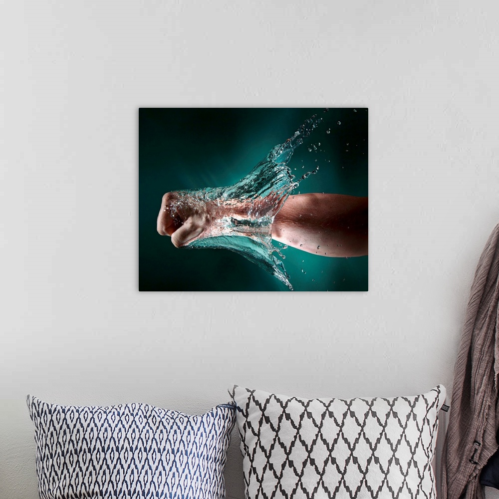 A bohemian room featuring Photo of a hand punching through a wall of water.