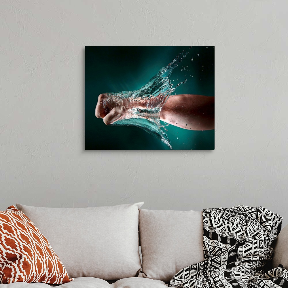 A bohemian room featuring Photo of a hand punching through a wall of water.