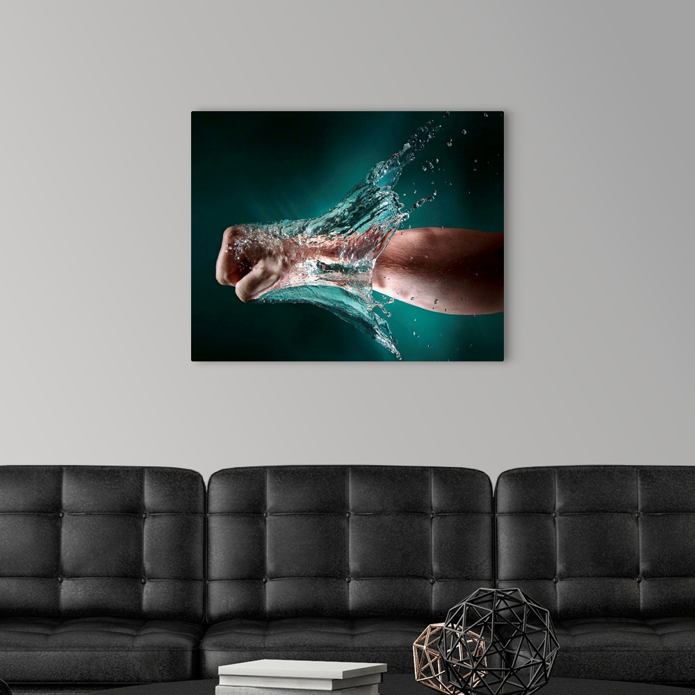 A modern room featuring Photo of a hand punching through a wall of water.