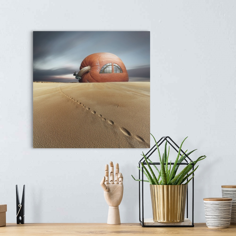 A bohemian room featuring Conceptual photo of a house made of a giant pumpkin in the sand.