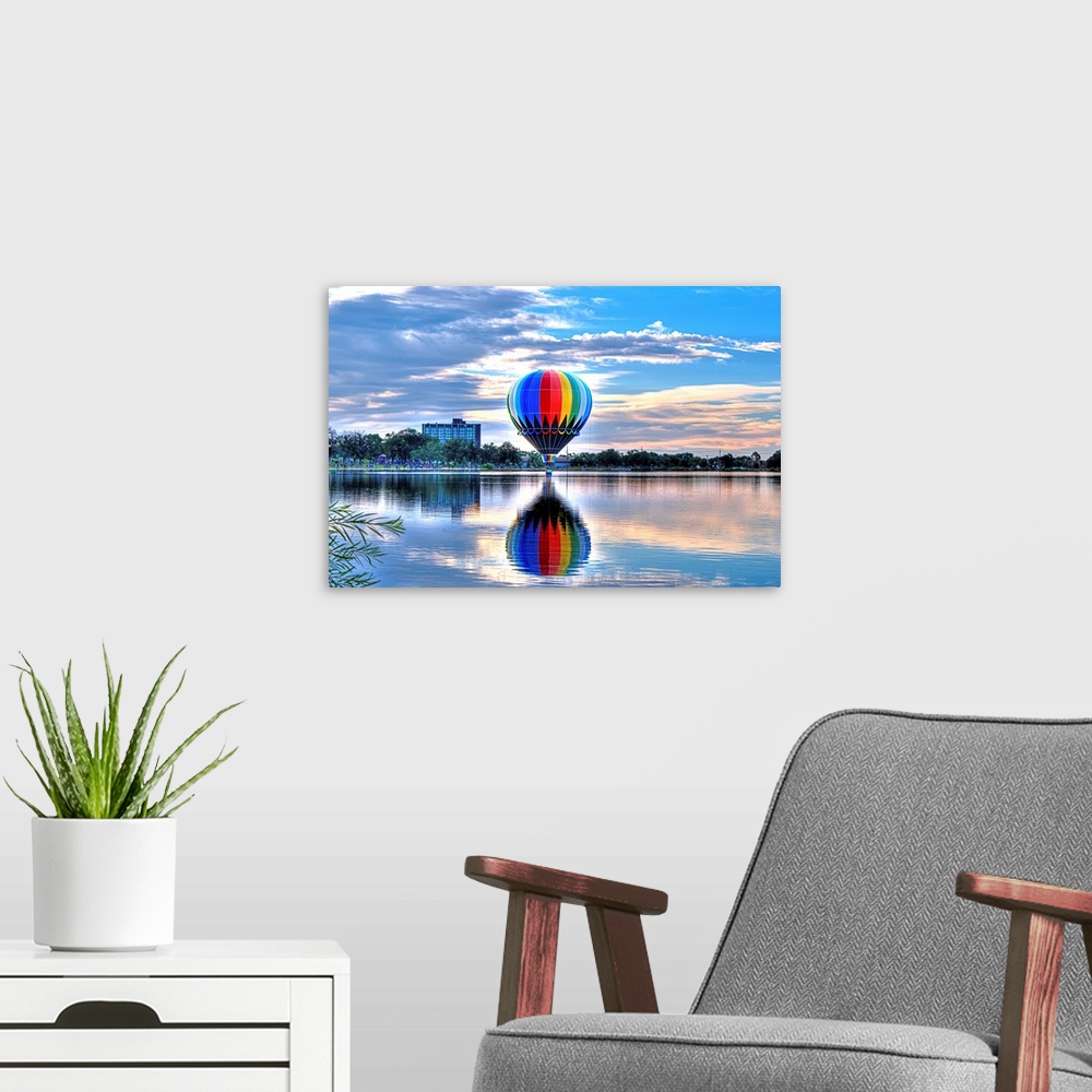 A modern room featuring Colorado Springs Balloon Classic over Prospect Lake.