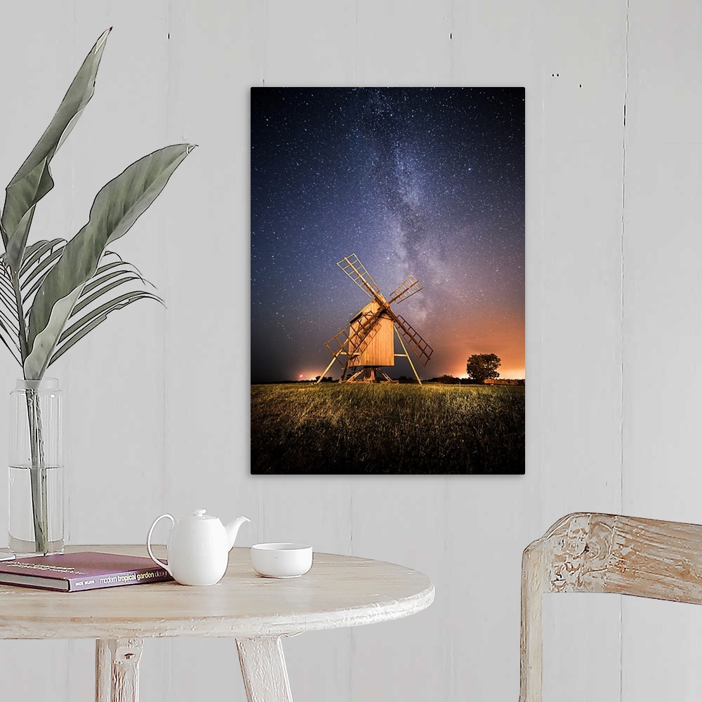 A farmhouse room featuring Windmills at night under a starry sky, Resmo, Oland, Sweden.