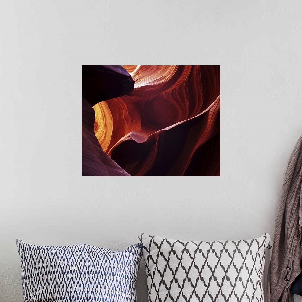 A bohemian room featuring Fine art photograph of a close-up of Antelope Canyon's rock formations.