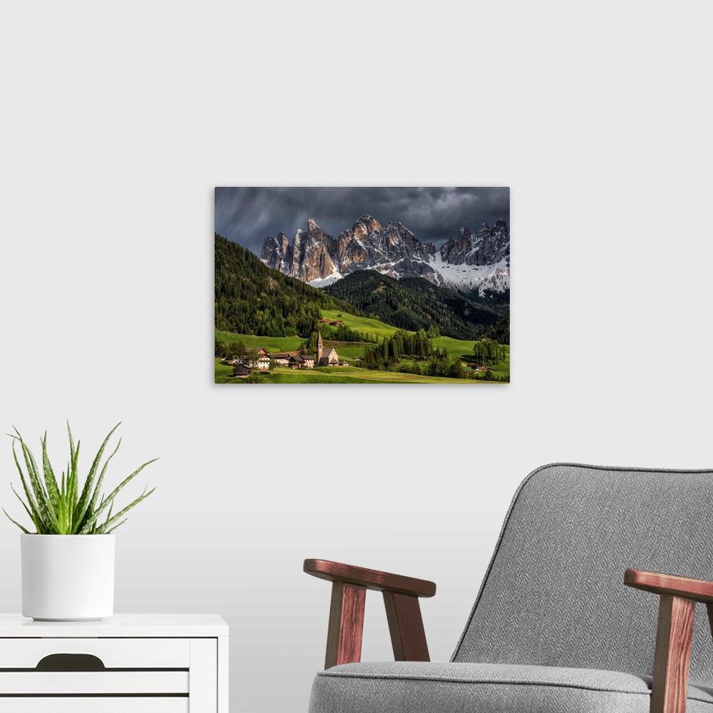 A modern room featuring The Alpine village of Santa Maddalena, in the Val di Funes. The background mountains are the Odle...
