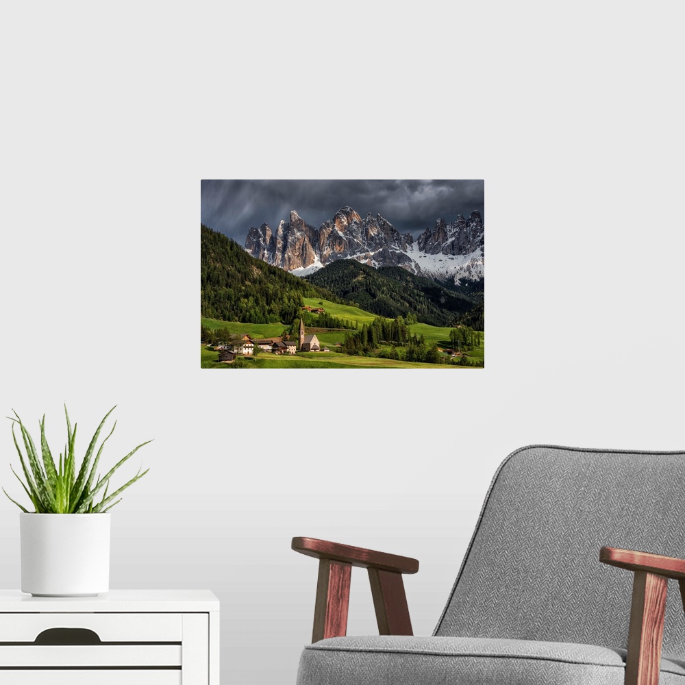 A modern room featuring The Alpine village of Santa Maddalena, in the Val di Funes. The background mountains are the Odle...