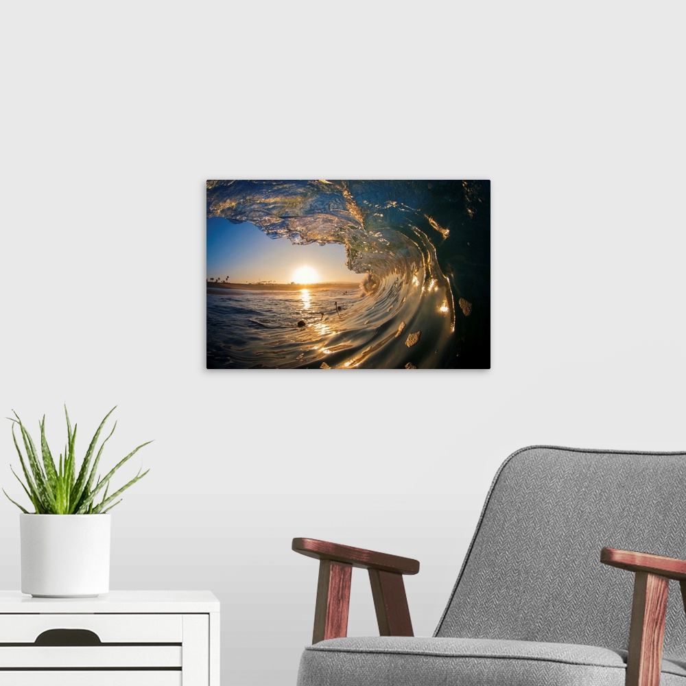 A modern room featuring Large ocean wave arcing over the setting sun on the horizon.