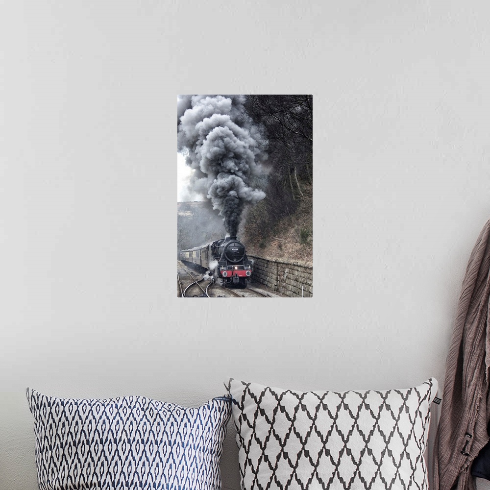 A bohemian room featuring Lots of steam from a locomotive's smokestack.