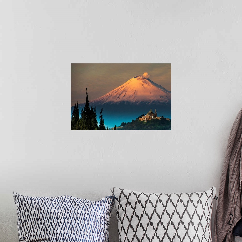 A bohemian room featuring Clouds of ash rising from snowy  Popocatepetl volcano, Mexico.