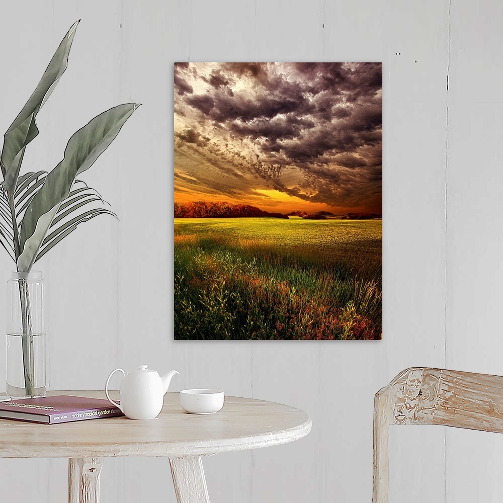 A farmhouse room featuring Dramatic cloudscape at sunset over a field of farmland.