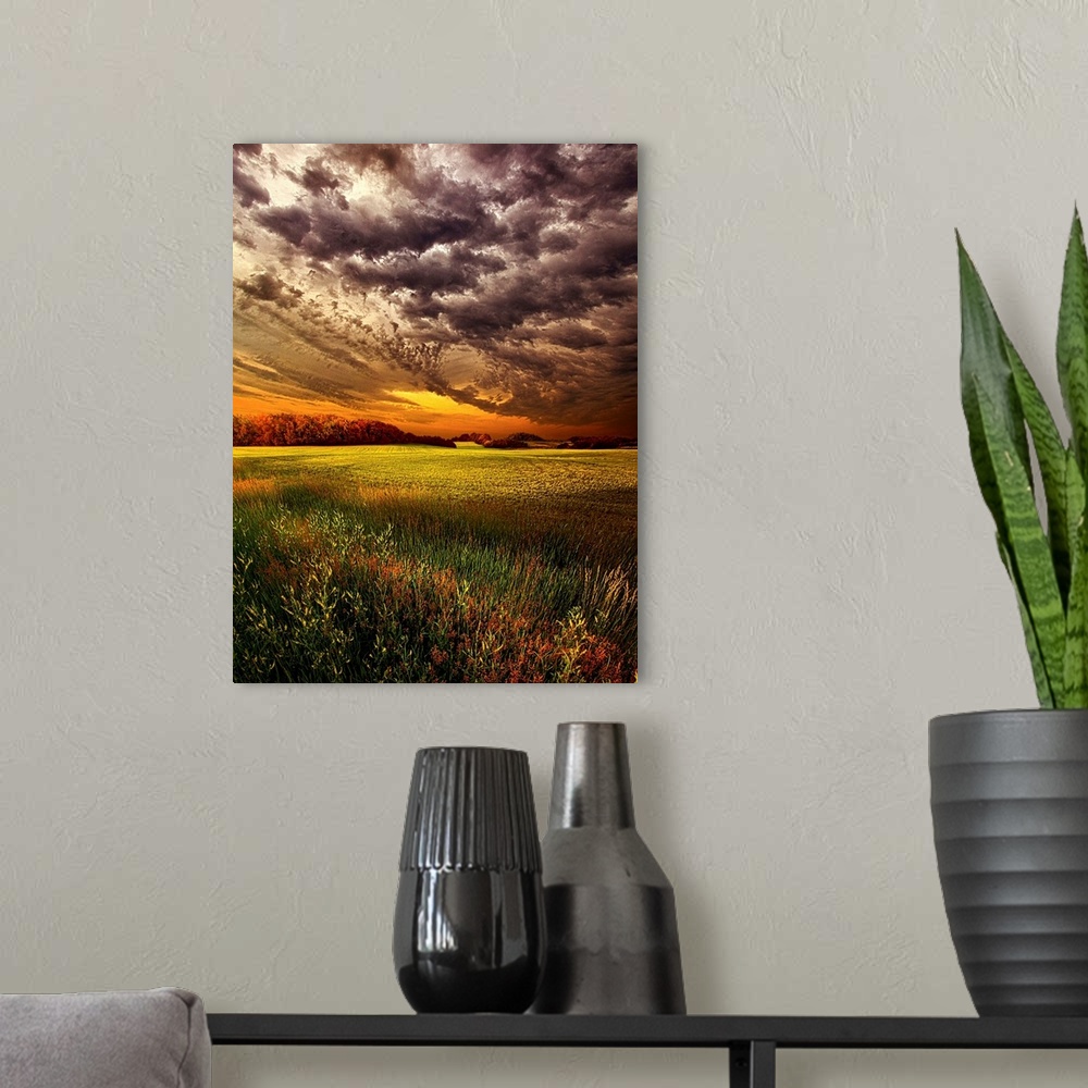 A modern room featuring Dramatic cloudscape at sunset over a field of farmland.