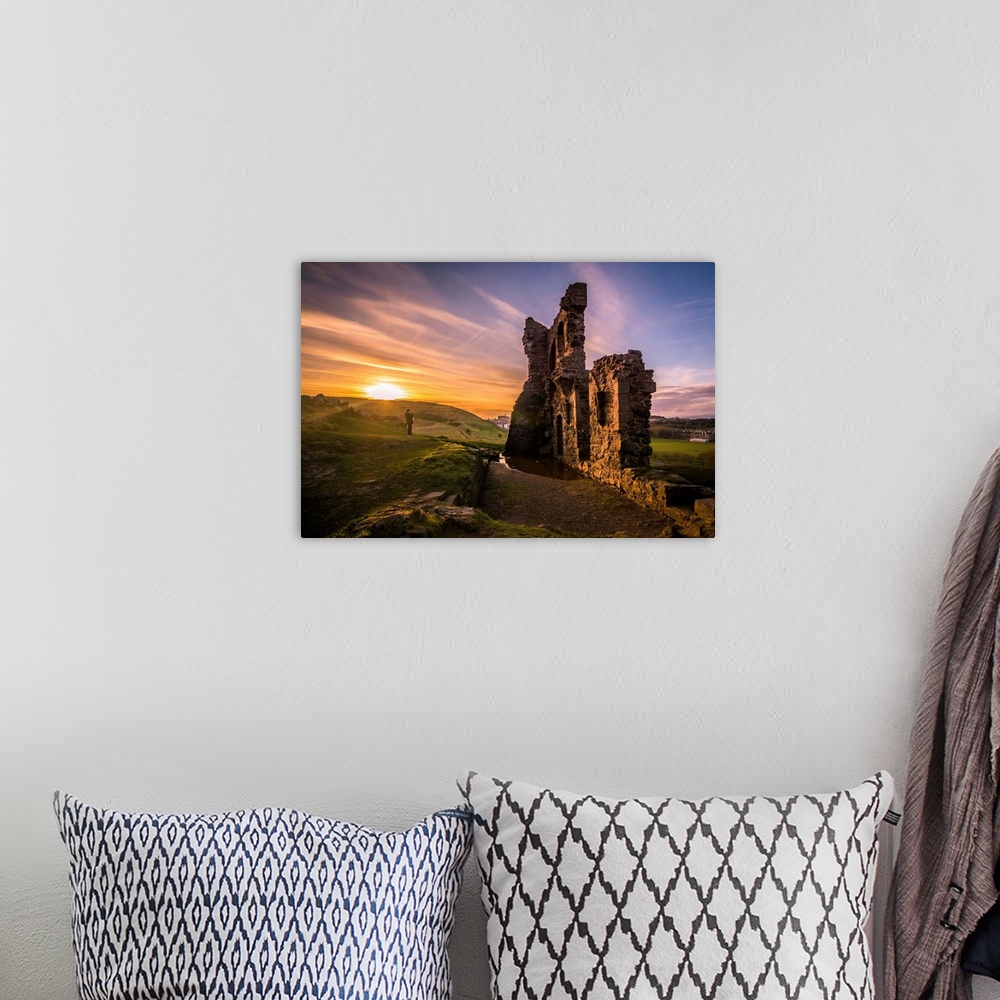 A bohemian room featuring Sun setting on the horizon near the ruins of St. Anthony's Chapel in Edinburgh, Scotland.