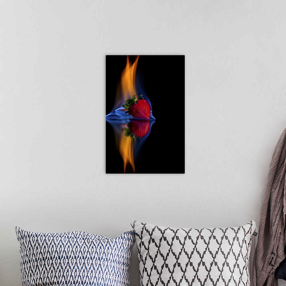 A bohemian room featuring Burning strawberry on a mirror with a black background.