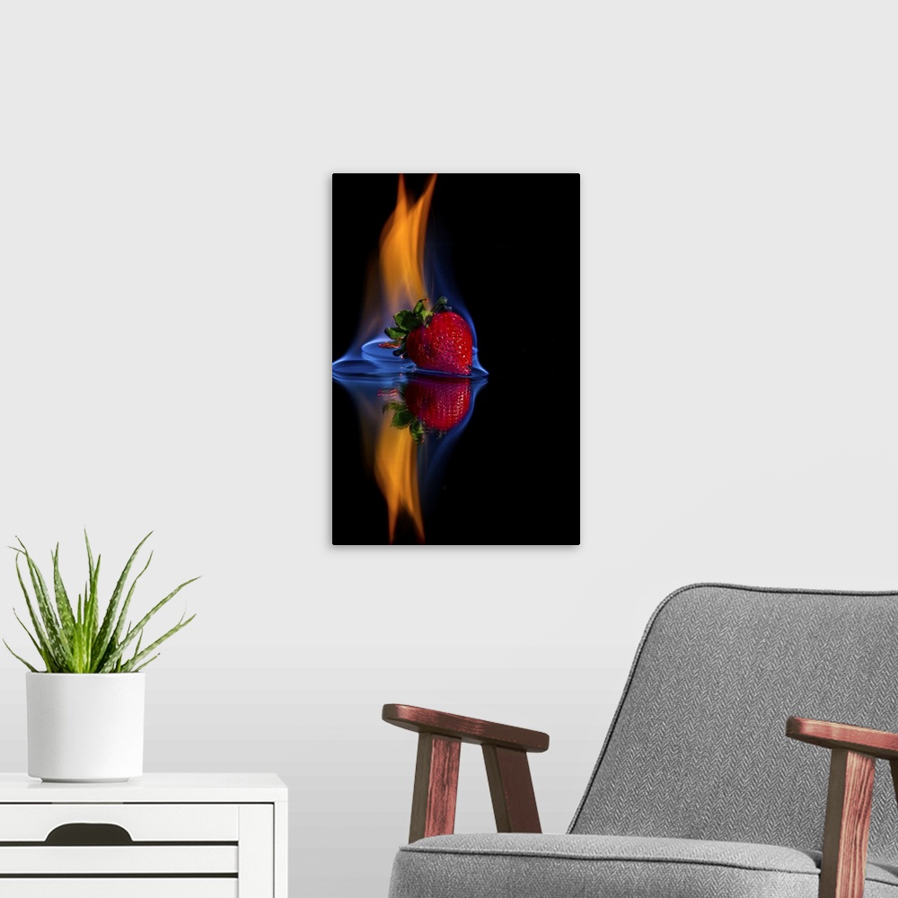 A modern room featuring Burning strawberry on a mirror with a black background.