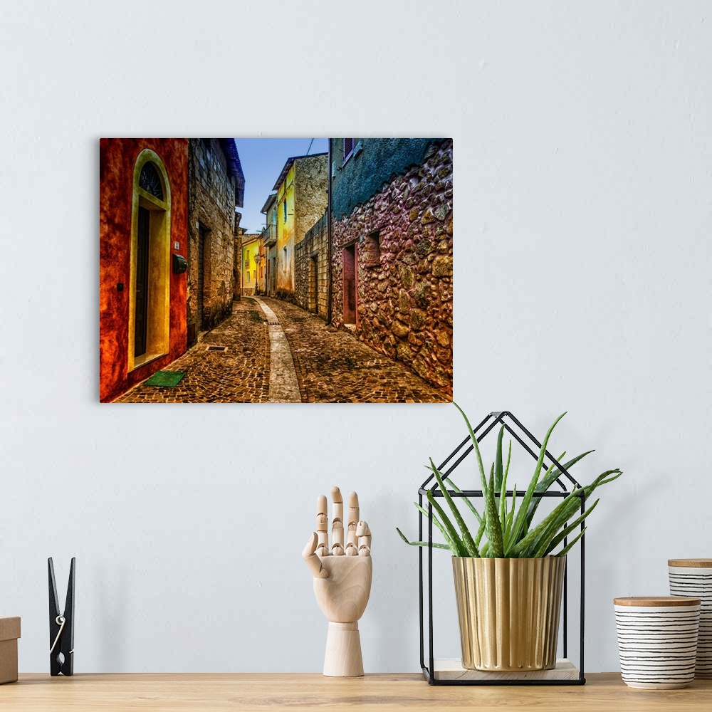 A bohemian room featuring A cobblestone alleyway lined with colorful buildings.