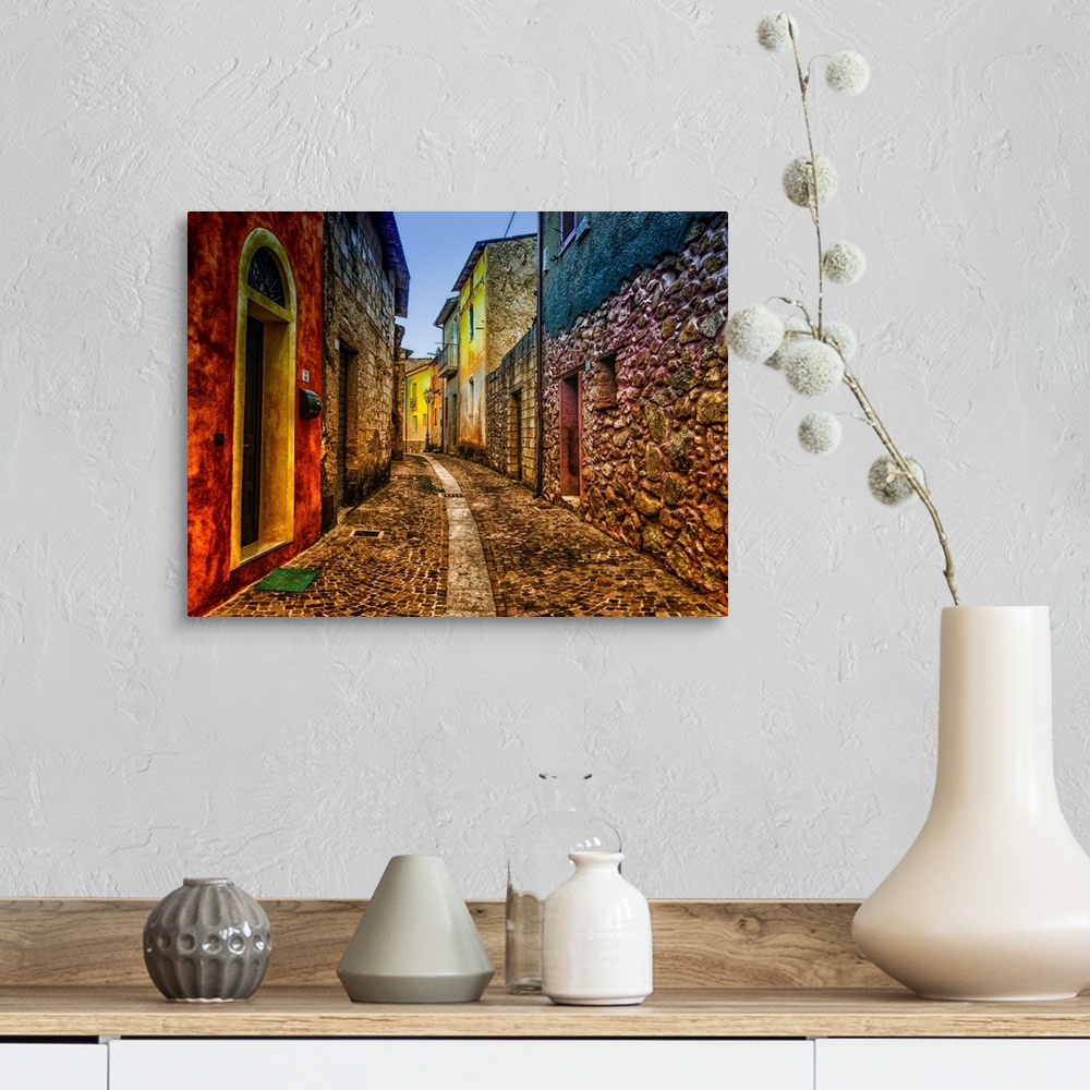 A farmhouse room featuring A cobblestone alleyway lined with colorful buildings.