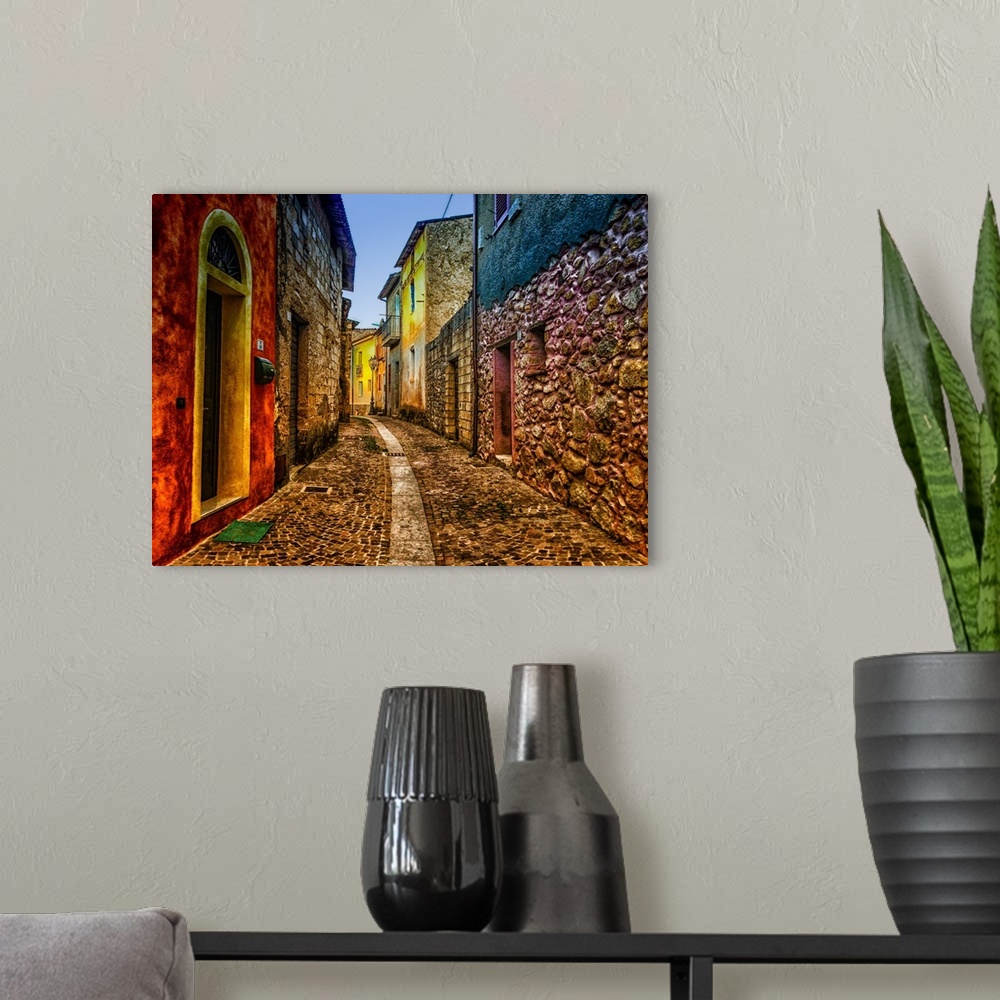 A modern room featuring A cobblestone alleyway lined with colorful buildings.