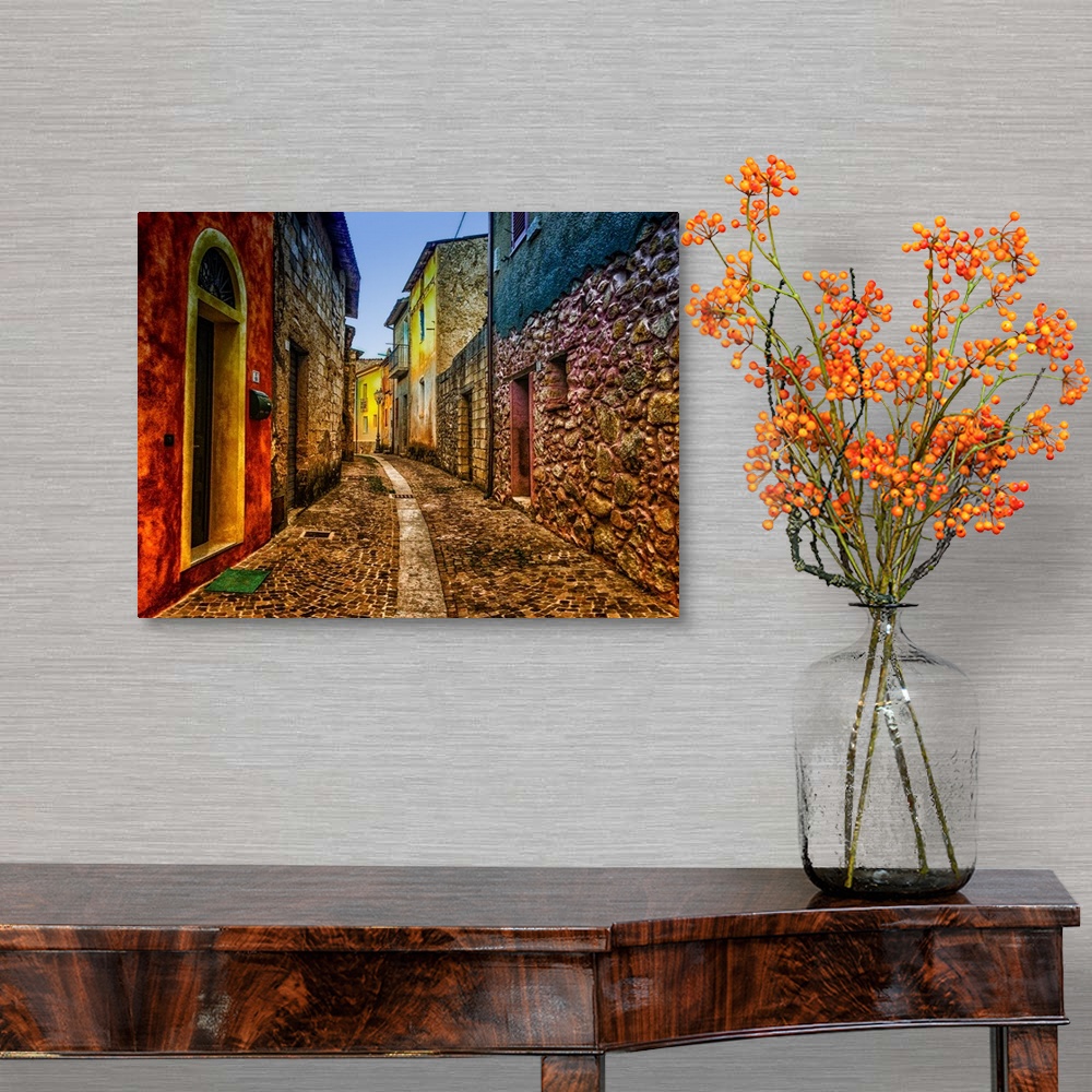 A traditional room featuring A cobblestone alleyway lined with colorful buildings.