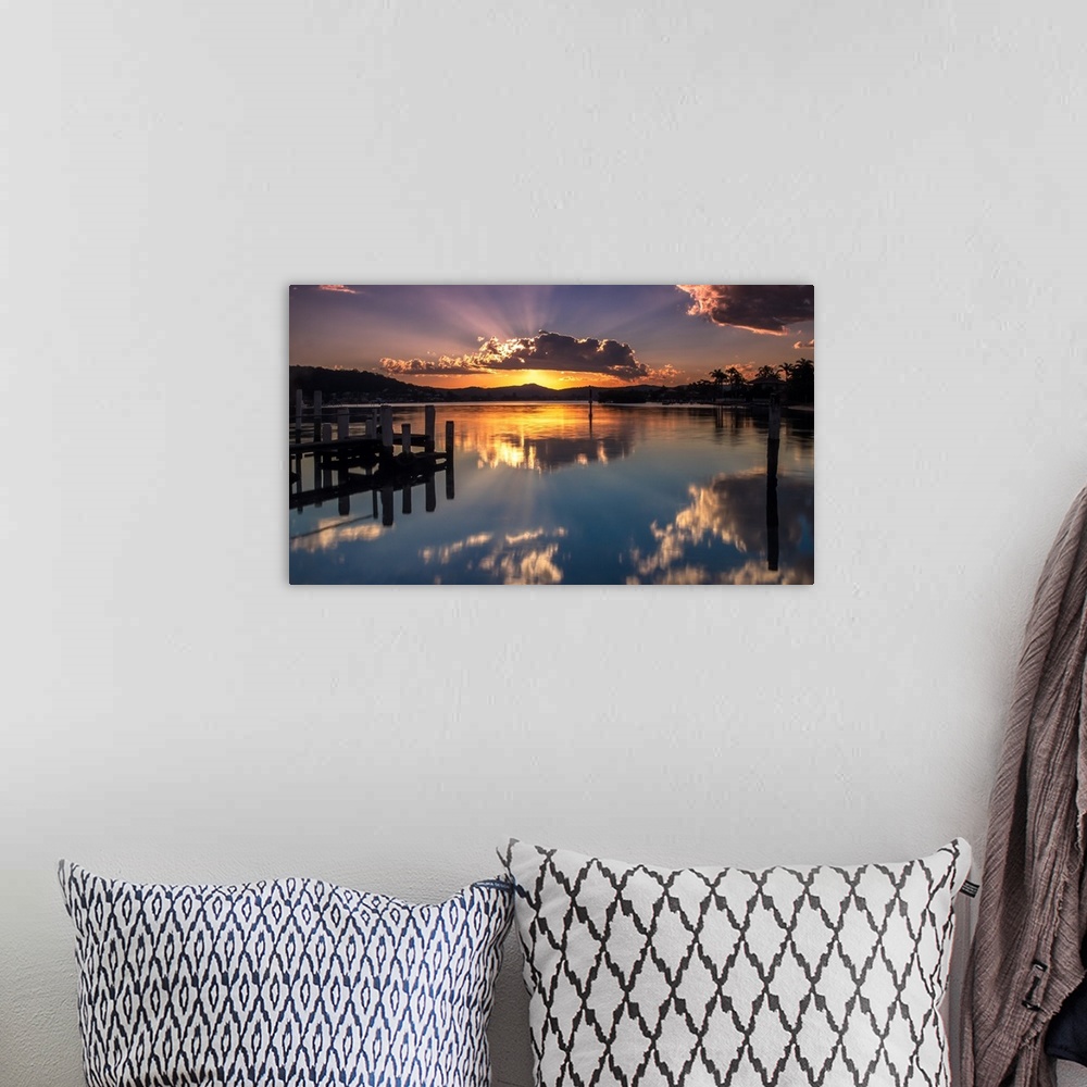 A bohemian room featuring A beautiful sunset with a crown cloud at Brisbane waters, Blackwall, Central Coast, NSW, Australia.