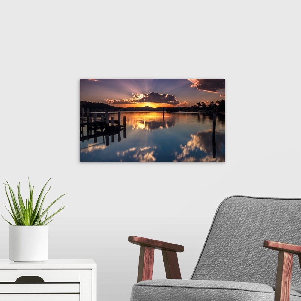 A modern room featuring A beautiful sunset with a crown cloud at Brisbane waters, Blackwall, Central Coast, NSW, Australia.