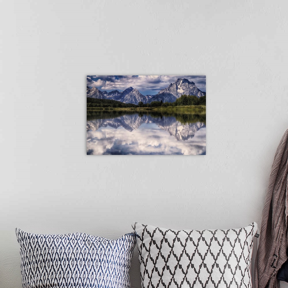A bohemian room featuring A mirror image of the Tetons reflecting on the Snake River at Oxbow Bend.
