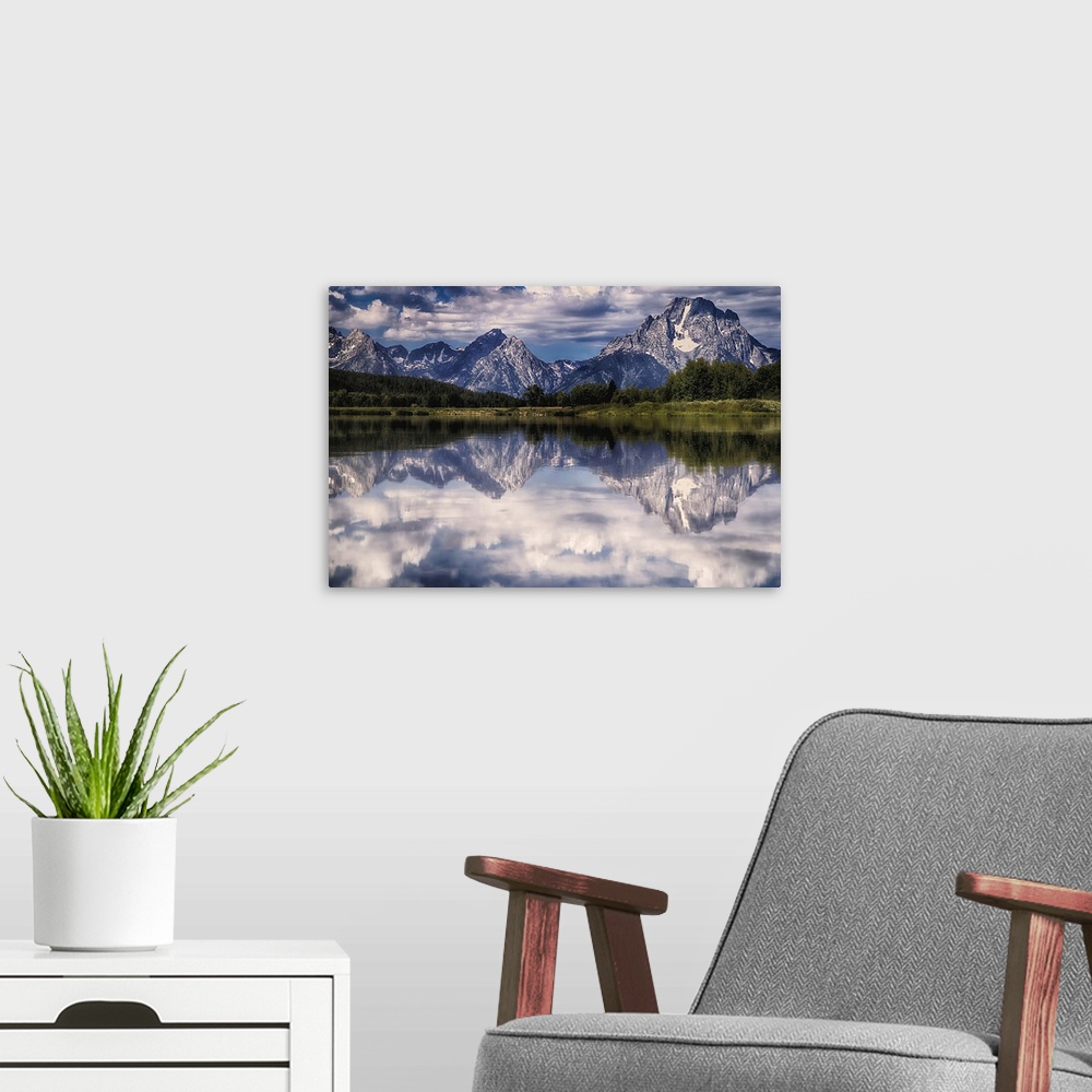 A modern room featuring A mirror image of the Tetons reflecting on the Snake River at Oxbow Bend.