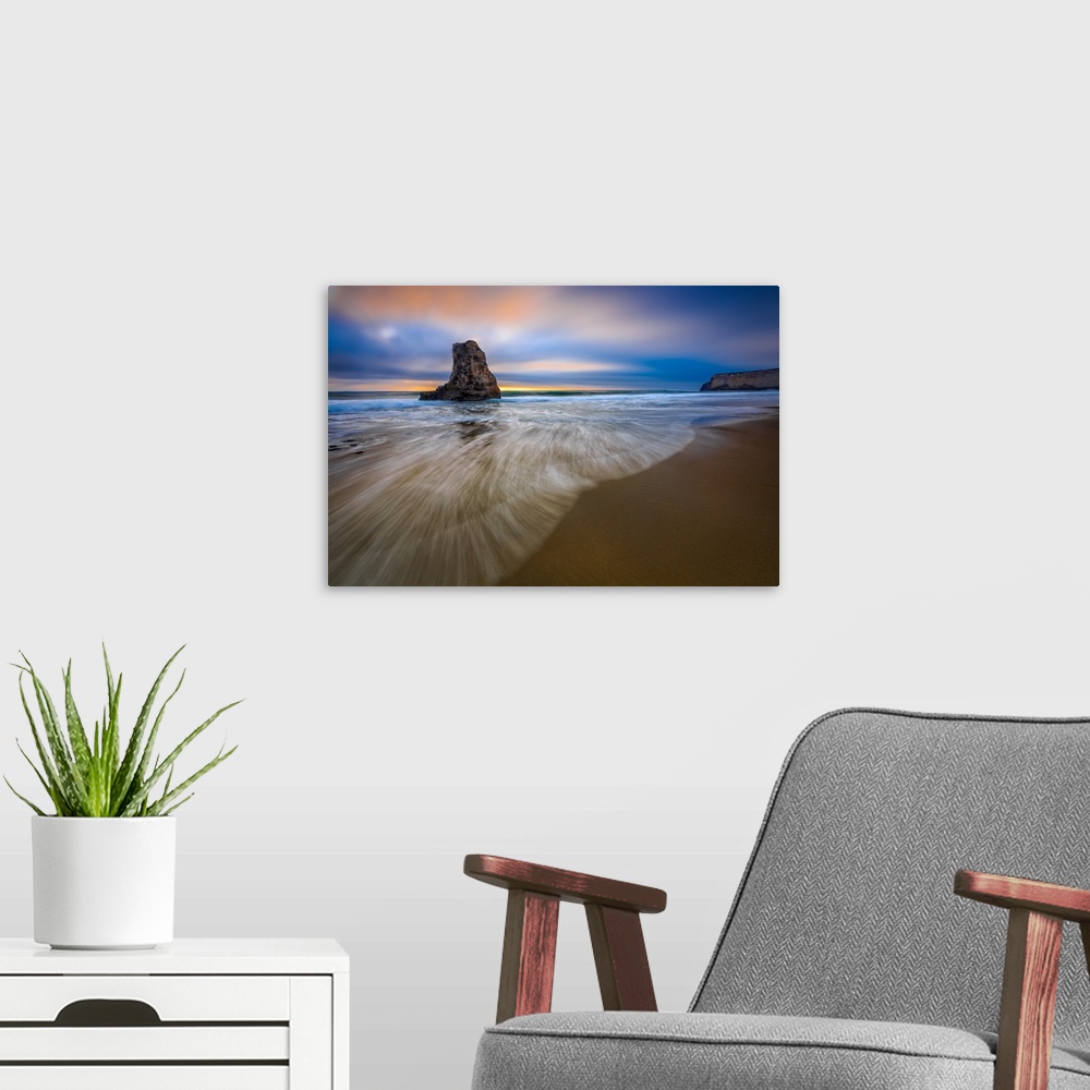 A modern room featuring Sea stack in the ocean on the Santa Cruz beach, California, at sunset.