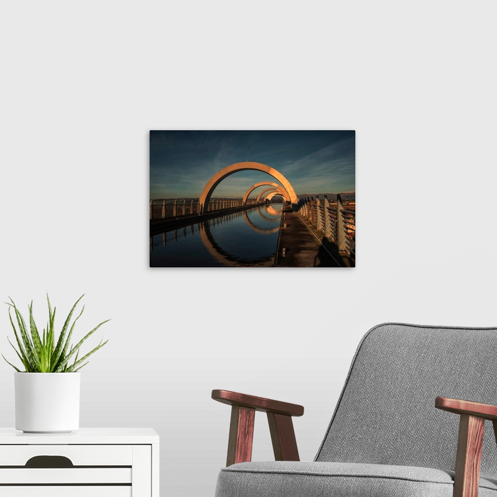 A modern room featuring The Falkirk Wheel is a rotating boat lift in Scotland, connecting the Forth and Clyde Canal with ...