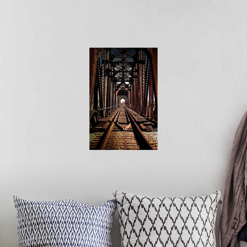 A bohemian room featuring Train tracks over a trestle bridge.