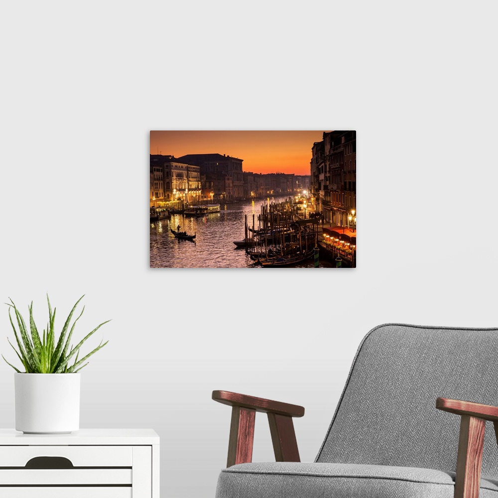A modern room featuring Venice at dusk, taken from Rialto Bridge.