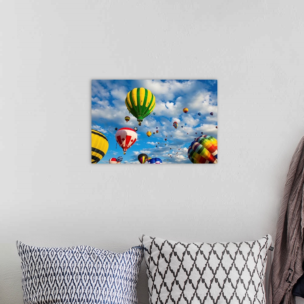 A bohemian room featuring Vibrant hot air balloons in flight.