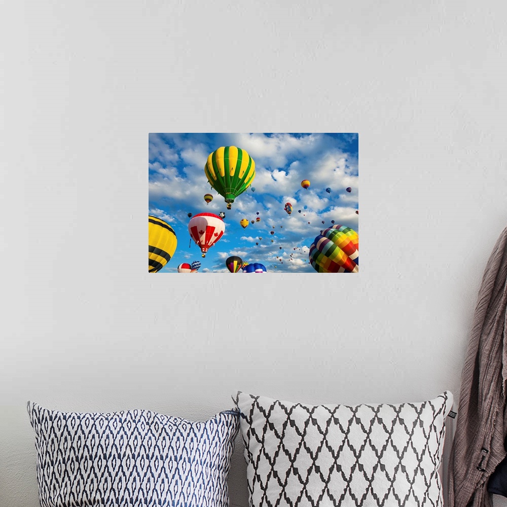 A bohemian room featuring Vibrant hot air balloons in flight.