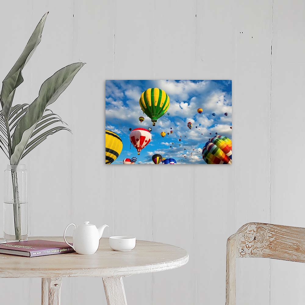 A farmhouse room featuring Vibrant hot air balloons in flight.