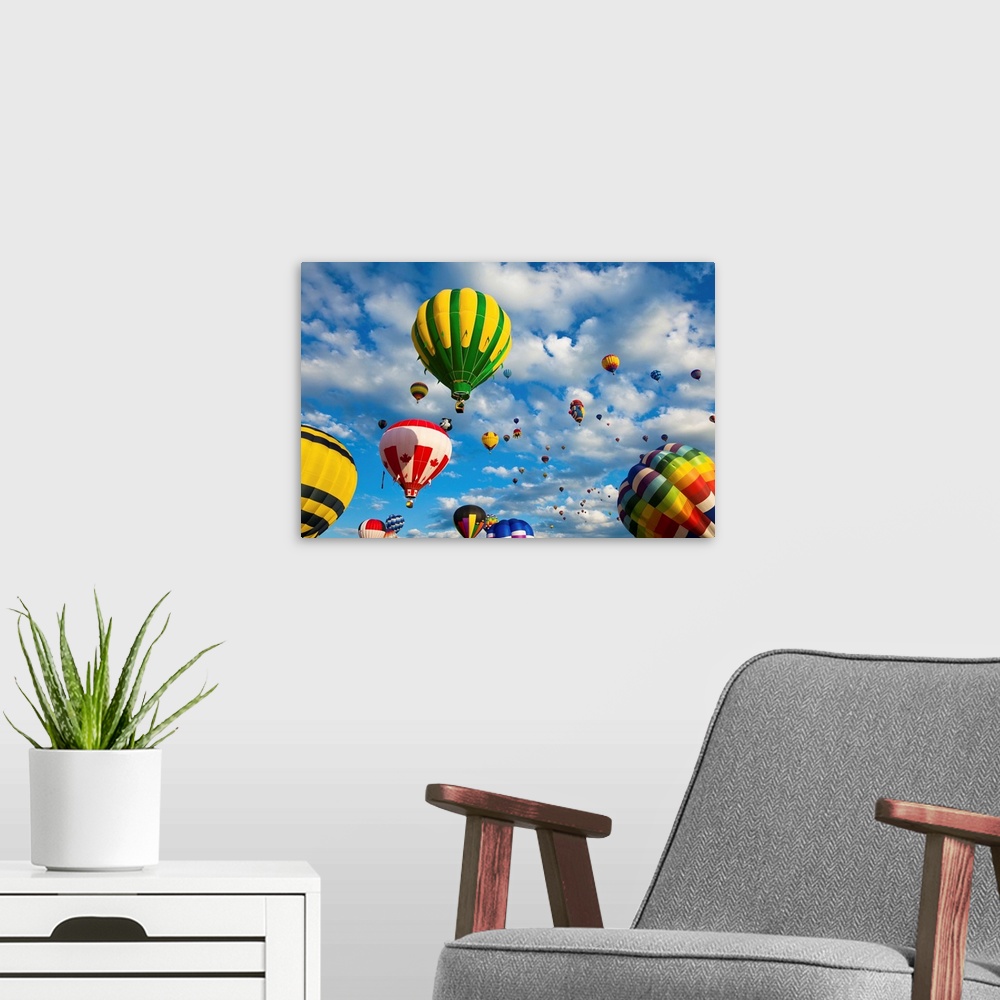 A modern room featuring Vibrant hot air balloons in flight.