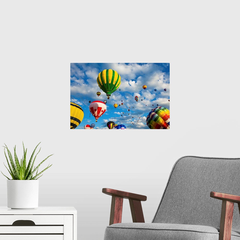 A modern room featuring Vibrant hot air balloons in flight.