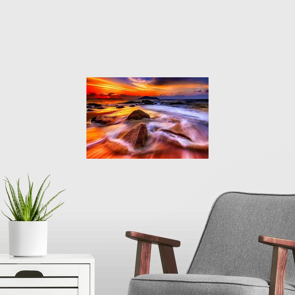 A modern room featuring Waves and Rocks at Sunset