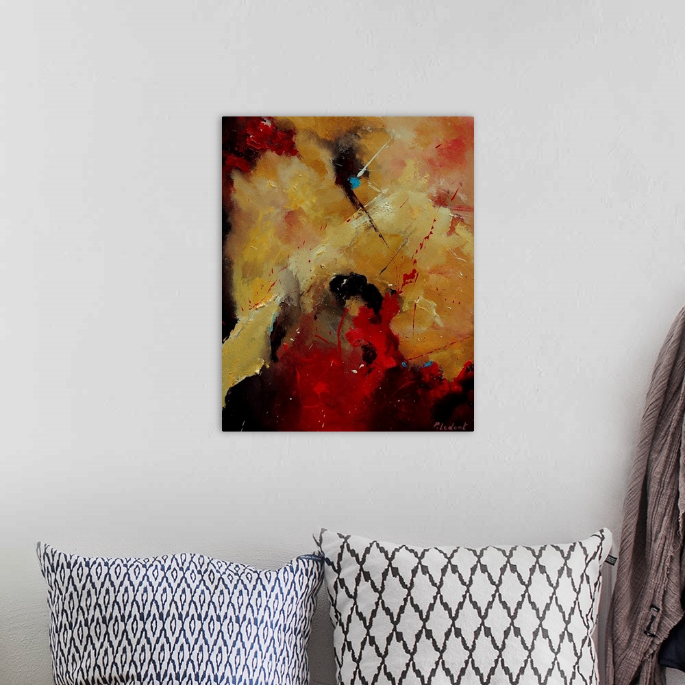 A bohemian room featuring A vertical abstract painting with deep colors of red, orange and yellow.