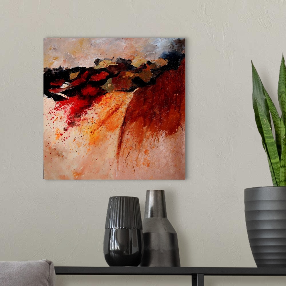 A modern room featuring Abstract painting of colors of orange, red and black in textured brush strokes and splattered paint.