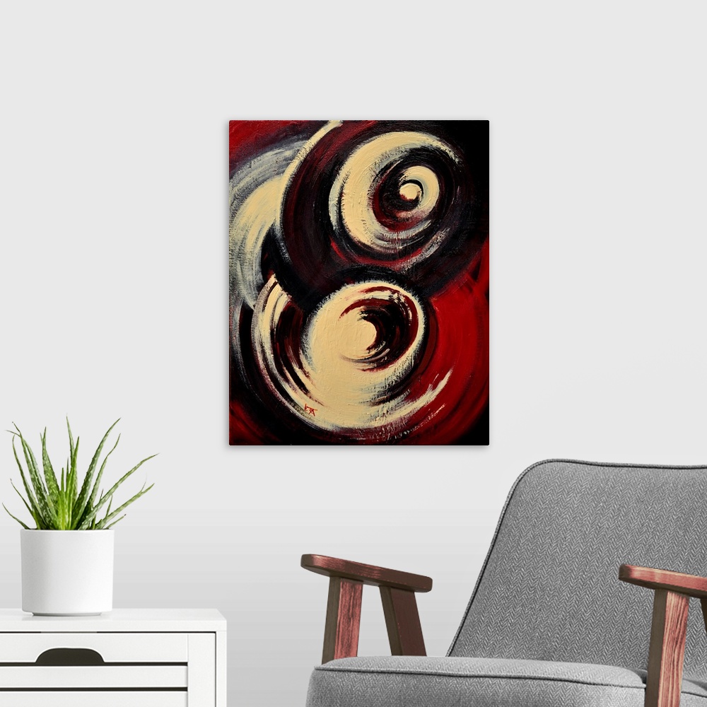 A modern room featuring A vertical abstract painting of two large swirls of color in beige, black and red.