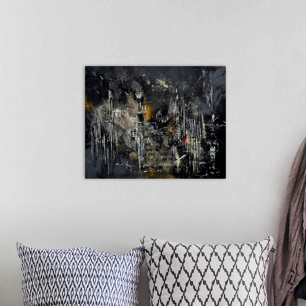 A bohemian room featuring Abstract painting in dark shades of black, white and gray with splatters of paint overlapping and...